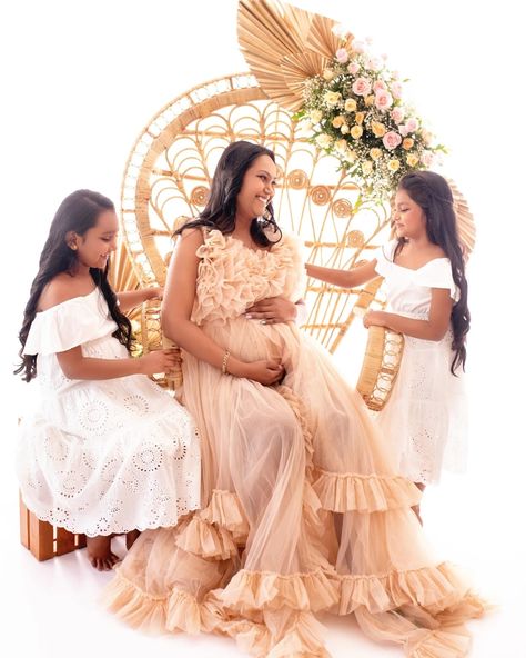 Indoor pregnancy photoshoot in India with floral peacock chair in a beige tulle gown. Soft beige tones maternity photoshoot Indoor Maternity photoshoot in india. Posing ideas for maternity potoshoot. Frill outfit idea for maternity photoshoot. Potoshoot with older kids ideas. Frill Outfit, Indoor Pregnancy Photoshoot, Maternity Photoshoot Indoor, Poses On Chair, Indoor Maternity Photoshoot, Photoshoot Indoor, Pregnancy Poses, Floral Peacock, Peacock Chair