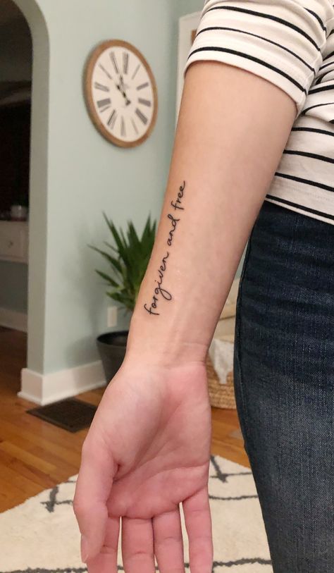 My wrist tattoo that says “Forgiven and Free” Christian Wrist Tattoos, Forearm Word Tattoo, Wrist Tattoos Quotes, Forgiveness Tattoo, Inner Wrist Tattoos, Scripture Tattoos, Grace Tattoos, Forearm Tattoo Quotes, Side Wrist Tattoos