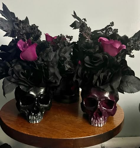 "Gothic pair skull head tall flower pot wedding centerpiece filled with black roses, magenta roses, black rose buds and black stem accents, arranged in aCeramic skull pot. Skull flower pot centerpiece is super full with stems and picks, stands approx 14\" tall x 12\" wide pair bride & groom, black and purple magenta Super elegantly goth, Victorian dark, everyday gothic decor, table centerpiece, accent piece Great gothic home accent or gift. Anniversary, birthday or dark wedding centerpiece" Gothic Party Centerpieces, Goth Table Decor, Goth Wedding Ideas Decor, Gothic Victorian Wedding Theme, Goth Wedding Centerpieces, Black Centerpieces Wedding, Gothic Centerpieces, Gothic Wedding Centerpieces, Goth Wedding Decorations