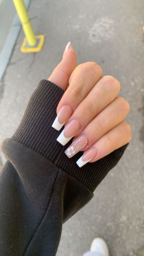 White French Tips With Hibiscus, White French Tip With Hawaiian Flower, French Tip With Flower On Ring Finger, White Nails With Hibiscus Flowers, French Tip Nails With Design On Ring Finger, Nails Ring Finger Different, White French Tip With Hibiscus Flower, French Nails With Design On Ring Finger, French Tips With Design On Ring Finger