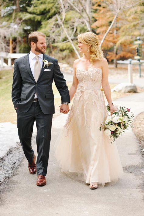 Nate wore an Andrisen Morton charcoal gray suit with a custom gold tie and pocket square from the Knotty Tie in Denver, Colorado. He gave the custom ties and pocket squares to his groomsmen as a gift too. Groom Attire Rustic, Groomsmen Attire Grey, Champagne Wedding Dress, Champagne Tie, Groom Suit Grey, Wedding Groomsmen Attire, Grey Suit Wedding, Wedding Dress Champagne, Gold Tie