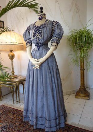 Extraordinary Reception Gown, ca. 1901..Navy and white pin stripe paper silk reception gown, ca. 1901. Bodice with puffed short sleeves. Lace and dark lavender/navy blue silk soutache trims. Rich decorated with two kind of laces. Matching belt. 1900s Dress, Edwardian Gowns, 1900 Fashion, 1900s Fashion, 1910s Fashion, Reception Gown, Edwardian Dress, Old Dresses, Victorian Clothing