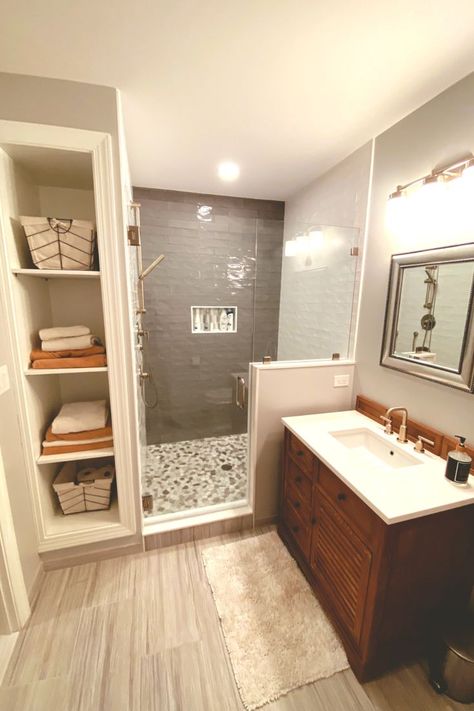 Our amazing remodeling team transformed our customer's bathroom into a calm oasis -- complete with a luxurious shower with new tiles and and built in cubbies to store linens and towels. Bathroom Built Ins, Built In Cubbies, Tub To Shower Remodel, Bathroom Transformation, Bathroom Redesign, Master Bath Remodel, Bathroom Remodel Designs, Bathroom Layout, Elegant Bathroom