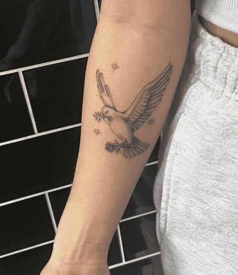 Dove With Initial Tattoo, Dove Tattoo On Neck, Dove Tattoo With Flowers, Dove Tattoo Arm, Dove Arm Tattoo, Dove With Flowers Tattoo, Dove Holding Olive Branch Tattoo, Dove Back Tattoo, Dove Tattoo Traditional