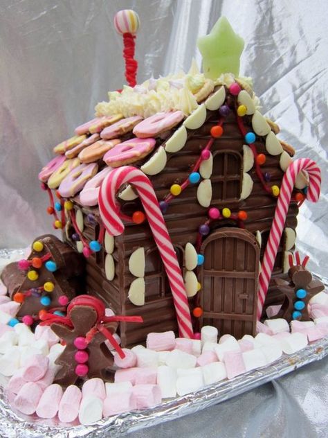 Chocolate bar Gingerbread house decorated with marshmallows and cookies Gingerbread House Ideas, Cool Gingerbread Houses, Gingerbread Dough, Chocolate House, Gingerbread House Designs, All Things Gingerbread, Gingerbread Village, Gingerbread House Decorations, Candy House