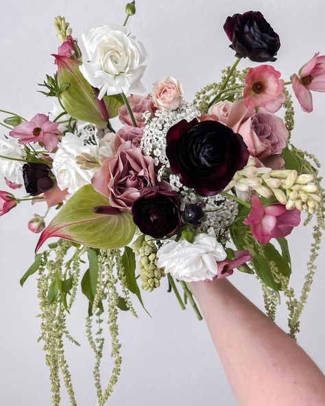 This bouquet is a mood—sultry, soft, and seriously stunning. We played with contrasting textures and colors to create something truly unique, and here’s how it all came together: ✨ Deep, moody ranunculus in rich black to add drama. ✨ Soft blush roses for a romantic, delicate touch that balances out the darker tones. ✨ Cascading greenery and textural accents to keep things fresh, organic, and full of movement. ✨ Those white ranunculus? They bring just the right amount of brightness to tie ... Moody Spring Bouquet, White Ranunculus, Spring Bouquet, Blush Roses, Ranunculus, 30th Birthday, Flowers, Color