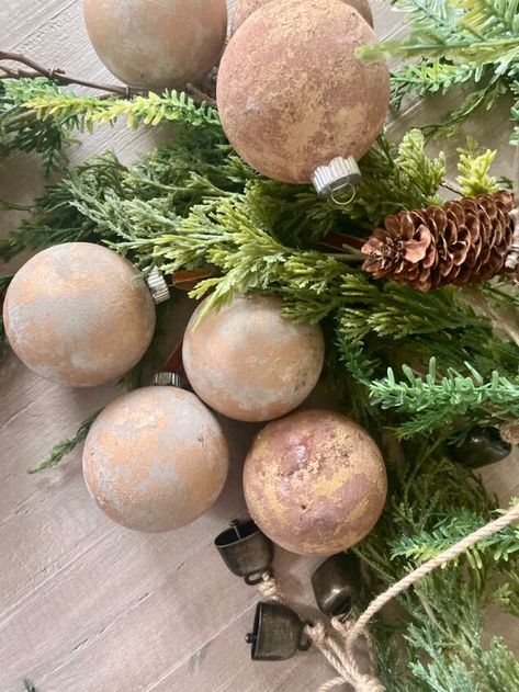 I’ve seen many ways to do this, but here’s my take on it. You can definitely buy them, but it’s a fun project to do with the kids or by yourself. I love how they turned out! Here’s what you’ll need.clear glass or plastic balls (dollar Tree, Amazon)cream paint, brown paint (Dollar Tree)gold paint , bronze paint (Dollar Tree)velvet Ribbon (Temu)baking soda (Walmart) Start by painting the ball. Before the paint dries, sprinkle some baking soda over it, then set aside to dry. Once… Bronze Tree Christmas, Diy Baking Soda Ornaments, How To Age Christmas Ornaments, Baking Soda Ornaments, Rub N Buff Ornaments, Rub N Buff Christmas Ornaments, How To Spray Paint Old Christmas Ornaments, Faux Mercury Glass Ornaments Diy, Walmart Paint