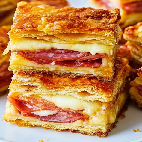 Looking for a new appetizer? These antipasto squares are always a hit! With plenty of cheese, meat, and pepperoncini, they're a fun twist on classic antipasto! Italian Antipasto Squares, Puff Pastry Italian Appetizers, Salami Crescent Roll Recipes, Puff Pastry Salami Recipes, Fillo Dough Recipes Appetizers, Antipasto Squares Crescent Rolls, Italian Squares, Stromboli Sandwich, Salami Appetizers