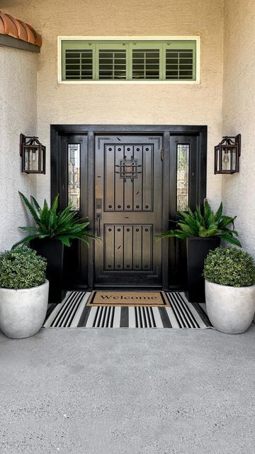 Kimberly Blank on Instagram: "Comment the word OUTDOOR for details to shop this reel sent straight to your dm.

A little front porch redo, with plants that will survive an Arizona summer…best decision!!

Follow me for more affordable home decor @liveloveblank 

#frontporchdecor #frontporch #amazonhome
Amazon home must haves
Front porch decor
Affordable home decor
Desert living" Southwest Front Porch Ideas, Front Porch Planter Ideas Entrance Flower Pots, Arizona Front Porch Ideas, Home Entrance Decor Outdoor, Front Porch Potted Plant Ideas, Front Porch With Plants, Front Porch Redo, Outdoor Entryway Ideas, Front Entrance Ideas