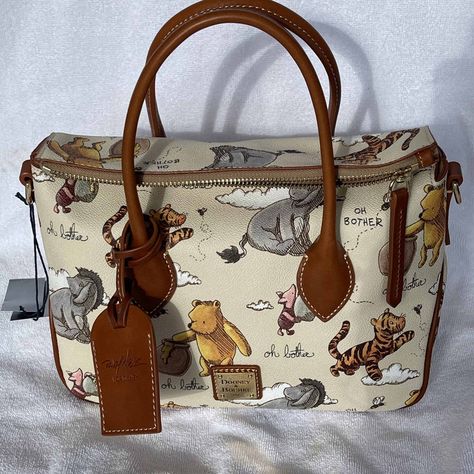 Disney Dooney and Bourke Classic Winnie the Pooh Collection | Disney Dooney & Bourke Guide - See more bags, handbags, and wallets from this collection at DisneyDooney.com #winniethepooh #piglet #tigger #eeyore #poohbear #disneydooney #disneydooneyandbourke #disneyparks #disneybag #disneyhandbag #disneyland Dooney And Bourke Backpack, Dooney Bourke Handbags Disney, Tigger Eeyore, Disney Purses, Disney Luggage, Disney Bags Backpacks, Personalized Leather Handbag, Disney Purse, Dooney And Bourke Disney