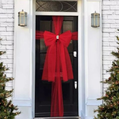 16 Front Door Decorations for Winter Festivities and Fun | Hunker Door Wrapped Like Present, Door Bow, Christmas Door Decoration, Simple Snowflake, Diy Butterfly, White Wreath, Christmas Front Doors, Christmas Front Porch, Holiday Door