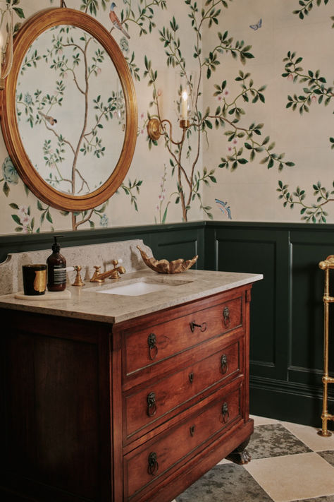 Here, we chose a beautiful Chinoiserie style paper by De Gournay which introduces a delicate and almost mesmeric quality to the space. Pairing it with half-height panelling in forest green is both a practical and stylish solution: it protects the paper from any water spray and the walls from any scuffing from passing traffic. Cloakroom Wallpaper, Wallpapers Interior, Elegant Powder Room, Sims Hilditch, Downstairs Cloakroom, Bathroom Paneling, Victorian Bathroom, Hand Painted Wallpaper, Green Bathroom