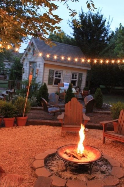 Firepit backyard area - love the lights too... and the garden shed. I want all of this in my yard... :) City Farmhouse, Backyard Area, Fire Pit Furniture, Meteor Garden 2018, Fire Pit Area, Magic Garden, Outside Living, Fire Pit Patio, Fire Pit Backyard