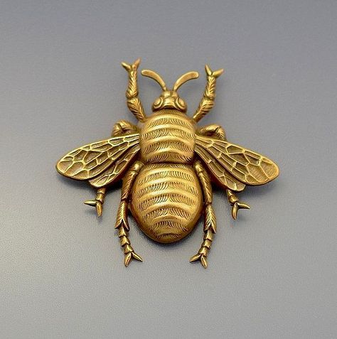 A bronze tone metal bee brooch by Joseff of Hollywood probably made in the 1960s-70s Insect Jewelry Design, Metal Bee, Silver Costume, Glitter Wall Art, Metalwork Jewelry, Costume Rings, Bee Jewelry, Bee Brooch, Insect Jewelry