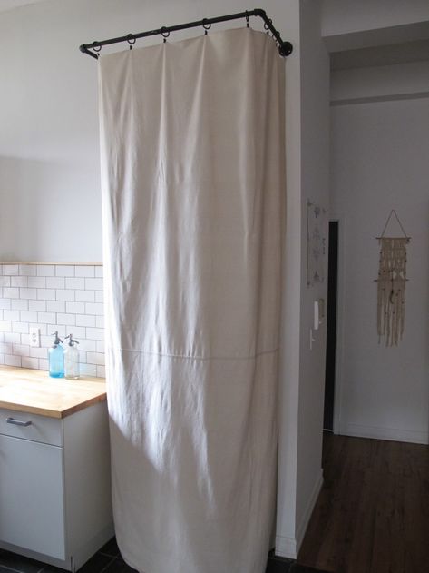 DIY: The $65 Laundry Closet, Renter's Edition - Remodelista Curtains To Hide Storage, Curtain To Hide Storage, Curtains To Hide Washer And Dryer, Hide Water Heater, Curtain Closet, Hide Pipes, Hidden Laundry, Coat Closet Organization, Utility Closet