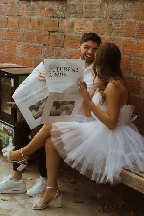 In And Out Engagement Photos, Engagement Theme Photoshoot, Engagement Photos Backdrop, Unique Pre Wedding Shoot Theme, Unique Fun Engagement Photos, Vintage Wedding Shoot Photography, News Paper Engagement Photoshoot, Newspaper Prop Photoshoot, Wedding Invite Photoshoot