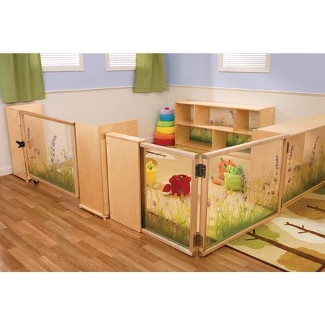 Create a unique nature-inspired early learning area! This Nature View Room Divider set provides stable and scenic toddler protection, as well as ample storage space. Pieces feature solid and sturdy wood construction with safe, clear acrylic panels imprinted with a peaceful scene of wildflowers. Perfect for dividing indoor space into separate activity areas in classrooms, daycares, and playrooms. <br><br><ul OLDSTYLE=color:black><LI>NATURE INSPIRED: The inviting nature scene imprinted on the acry Natural Infant Classroom, Playroom Divider Ideas, Daycare Room Dividers, Infant And Toddler Classroom Set Up, Divide Room Into Two Spaces Kids, Daycare Nap Room, Daycare Ideas Room, Infant Play Area In Living Room, Small Daycare Room Ideas