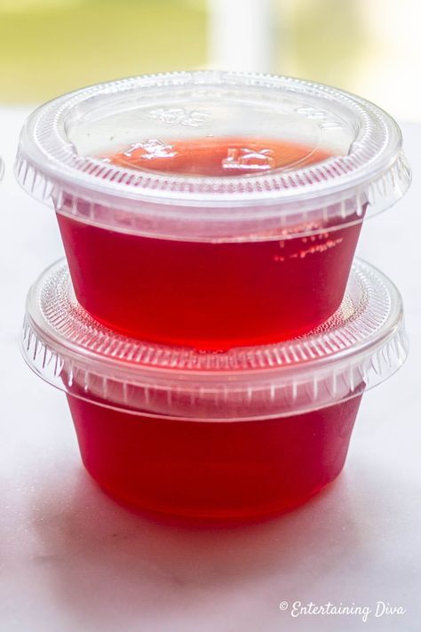 Cosmopolitan jello shots are a tasty recipe made with Citron Vodka, Cointreau (or Triple Sec) and cranberry jello. Click through to learn how to make these easy jello shots. #fromhousetohome #partyideas #cocktails #shooters #jelloshots #vodkajelloshots #valentinesday Jello Shots Christmas, Yummy Jello Shots, Strawberry Margarita Jello Shots, Easy Jello Shots, Margarita Jello Shots, Making Jello Shots, Champagne Jello Shots, Best Jello Shots, Jello Shots Vodka