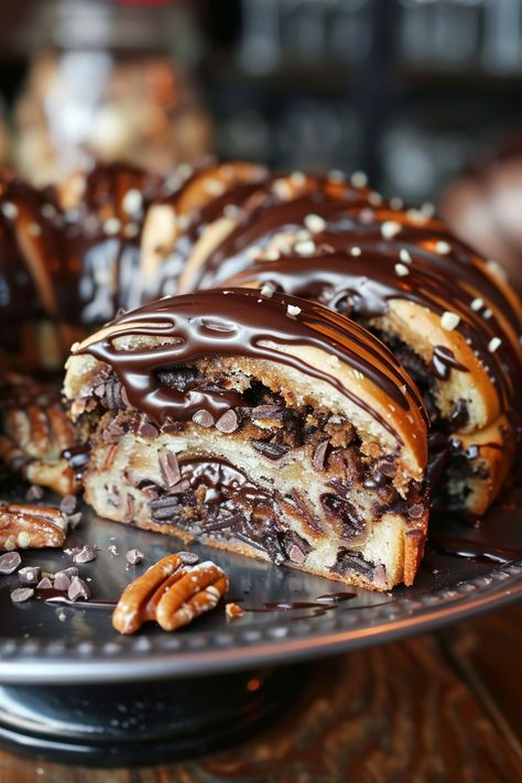 Chocolate-drizzled Bundt cake with pecans and chocolate chips on a dark plate. Babka Recipe Easy, Chocolate Buns Recipe, Chocolate Filled Bread, Beautiful Bread, Chocolate Babka Recipe, Chocolate Babka Filling, Chocolate Bun Recipe, Chocolate Babka Recipe Cooks Country, Easy Chocolate Babka Recipe