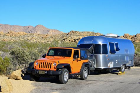 Can a Jeep Wrangler pull an Airstream? We answer all of your Jeep Wrangler towing questions in this Ultimate Guide to towing with a Jeep. Jeep Wrangler Camper, Pull Behind Campers, Jeep Unlimited, Airstream Bambi, Jeep Lifestyle, Jeep Jku, Jeep Trailer, Truck Pulls, Jeep Camping