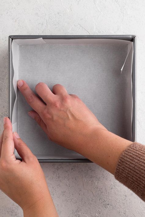 Have you ever wondered what's the best way to line pans with parchment paper? What's the easiest way to line square and rectangular pans? And what about round cake pans? In this article I'm sharing all of my tips - including detailed instructions and a video - for how to easily line baking pans of all different shapes and sizes with parchment paper. Lining Cake Pans Parchment Paper, How To Line A Pan With Parchment Paper, How To Line A Cake Pan With Parchment, How To Line A Square Pan With Parchment, How To Fold Parchment Paper For Cake Pan, Baking Conversions, 8x8 Pan, Cake Liner, Baking Videos