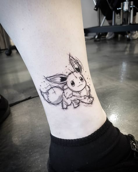 Mary J on Instagram: “Adorable Eevee done yesterday! Always love doing Pokemon tattoos 😍 eventually id love get to do all original 151! @east_end_tattoo •…” Small Eevee Tattoo, Simple Pokémon Tattoo, Eevee Tattoo Ideas, Eevee Tattoo Design, Eevee Pokemon Tattoo, Pokemon Tattoo Sleeve, Matching Pokemon Tattoos, Pokemon Flash Tattoo, Animated Tattoos