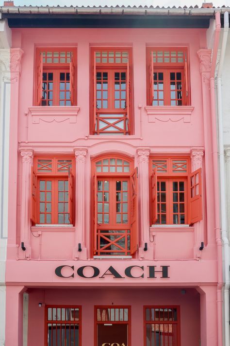 Keep an eye out for the Coach Play Singapore Shophouse as you stroll down Keong Saik Street. Easily recognizable, it is a three-story building freshly painted in a bold pink colour. If you’re wandering down Keong Saik Street, don’t miss the Coach Play Singapore Shophouse. You can’t miss it – it’s a three-story building that’s been painted a vibrant pink. It’s definitely a standout on the street. If you’re in the market for some unique shopping o... Pink Hotel Aesthetic, Singapore Aesthetic, Singapore Shophouse, Singapore Shopping, Singapore House, Store Facade, Pink Building, Cottage Details, Diner Aesthetic