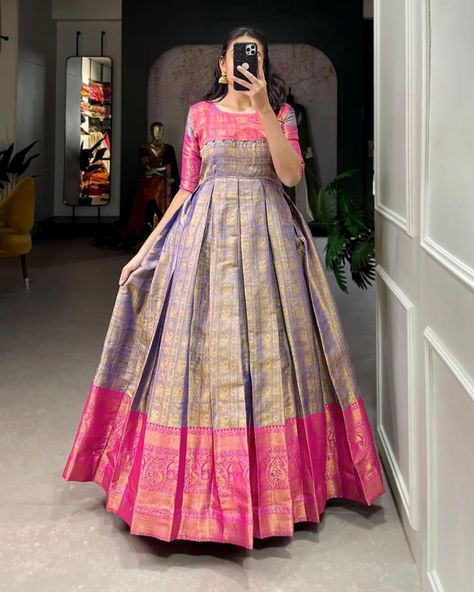 👉 Price- 1099/-+ shipping 👈 *🌷Kanjivaram Gown🌷* A joyful festive mood with Kanjivaram and zari weaving work appliqued gown 🌼 *Gown (Stitched)* 👉🏿Gown Fabric : Kanjivaram 👉🏿Gown Work : Zari Weaving Work 👉🏿Chest : 40" (Inside 2 inch extra margin available so you can adjust support up to 42 for your body comfort ) 👉🏿Waist : 38" 👉🏿Length : 56" 👉🏿Flair : 3.50 Meter 👉🏿Sleeve length : 13 👉🏿Lining : silk (full upto bottom) Code- H50 Pattu Long Frocks For Women Latest, Pattu Long Frocks For Women, Saree Dress Design Ideas, Long Frocks For Women, Frock Models, Frocks And Gowns, Simple Frock Design, Long Frock Designs, Traditional Gowns