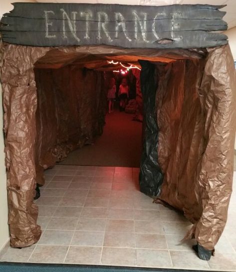 Cave entrance, approximately 100ft. long, complete with a water feature. The kids had to go through it to get to the worship rally. Each day I added "cave paintings" for them to look for. Door Decorations For School, Cave Quest Vbs 2016, Easter Door Decorations, Decorations For School, Cave Quest Vbs, Cave Quest, Wonder World, Trendy Easter, Cave Entrance