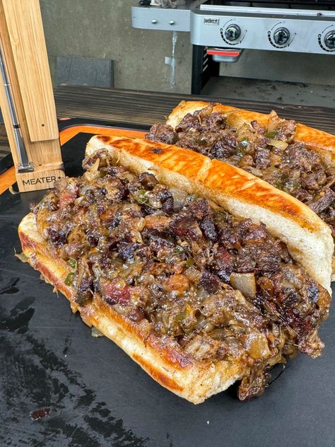 If you’re looking to elevate your cheesesteak game, this Smoked Brisket Cheesesteak recipe is the way to go. Imagine juicy, smoky brisket paired with melted cheese and sautéed veggies, all piled high on a toasted hoagie bun. It’s a crowd-pleaser that’s perfect for your next cookout or any time you want to treat yourself to... Easy Brisket Recipe, Bacon Jam Burger, Grill Nation, Philly Cheesesteaks, Cheesesteak Recipe, Ny Strip Steak, Brisket Sandwich, Brisket Recipes, Smoked Brisket