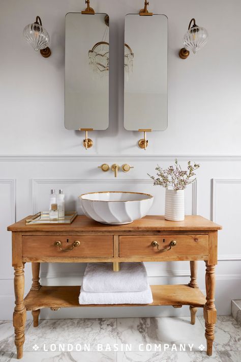 Having taken her cue from a French sideboard she found in an antiques shop, interiors blogger Phoebe Miller sought the perfect basin to sit on top. The delicate design of the Angelica basin tied in beautifully with the bath and light fittings to transform the bathroom into a tranquil oasis. Read our blog for design inspiration. Side Table Bathroom Vanity, Italian Toilet Design, Bathroom Basins Ideas, Turn Of The Century Bathroom, Sink Ideas Bathroom, French Bathroom Decor Vintage, Parisian Style Bathroom, Italian Bathrooms, Powder Room Vanity Ideas