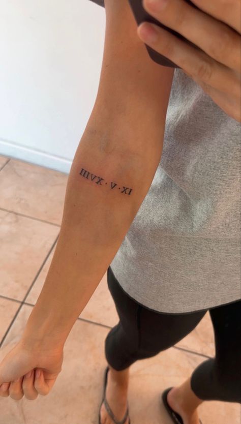 Year Tattoo Roman Numerals, 1977 Roman Numeral Tattoo, Roman Numeral Placement Tattoo, Birth Year Roman Numeral Tattoo, Tattoo Ideas Birthday Date, Roman Numeral Tattoo Women Arm, Date Tattoo Ideas Roman Numerals, Small Roman Numeral Tattoo Arm, 1973 Roman Numeral Tattoo