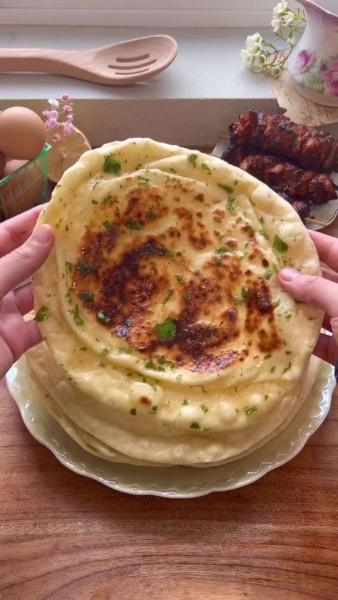 Fluffiest Homemade Garlic Naan ⏲🎞💐 Full recipe & instructions are on the blog, Mxriyum.comWhat you’ll need: Yeast mixture:- 1 cup Warm water- 1 tbsp Active dry yeast- 1/2 tbsp SugarRest of the ingredients:- 4 cups All purpose flour- 2 tsp Kosher salt- 3/4 tsp Baking soda- 3/4 tsp Baking Powder- 3/4 cup Plain Yogurt- 1/4 cup Olive oilOptional ingredients to add to your dough:- 6-10 Garlic cloves minced- Handful freshly chopped cilantroGarlic Ghee topping:- 1/2 cup High quality Ghee, meltedCompr Homemade Garlic Naan, Garlic Naan, Vegetarian Fast Food, Indian Cooking Recipes, Tasty Recipes Videos, Quick Recipes Snacks, Healthy Homemade Recipes, Sweet Snacks Recipes, Delicious Snacks Recipes