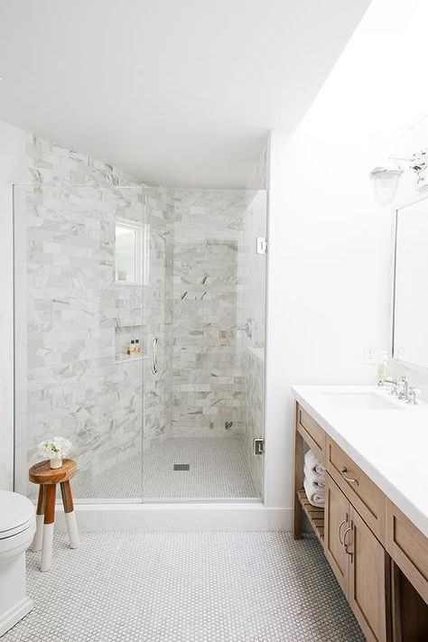 Gorgeous master bathroom boasts a caramel colored dual washstand atop a white penny tiled floor finished with light gray grout. White Penny Tile Bathroom, Penny Tile Bathroom, Penny Tile Bathroom Floor, Penny Tiles Bathroom, Penny Tile Floors, Office Light, Penny Tile, Bad Inspiration, Transitional Bathroom