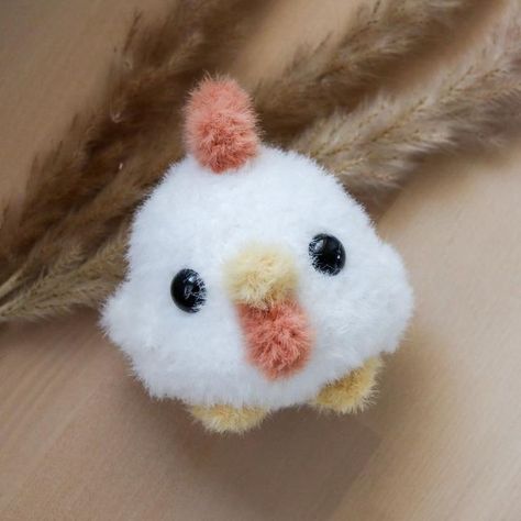 Kelsie Gélinas on Instagram: "Couldn't wait to try out my new @lionbrandyarn Feels Like Bliss colours!! Just finished crocheting a mini, fluffy version of my chicken pattern! 🐓🥹 It's godda be the cutest damn thing I've ever made! 😍 Who else loves creating tiny (and/or floofy 😏) versions of their favorite projects?   Pattern by me: Link to my Etsy and @ribblr_it shops is in my bio 💕  Yarn: Feels like Bliss in "White", "Buttercup" and "Peach" Hook: 3.5 mm  #crochet #crochetpattern #cochetchicken #amigurumi #amigurumichicken #amigurumipattern #chicken #cutechicken #chickenart #kawaii #kawaiiart #cuteanimal #art #artist #artistsofinstagram #craft #crafting #craftersofinstagram #crochetersofinstagram #fiberart #fiberartist #crochetbykelsie #easter #crocheteaster" Crochet Fluffy Chicken, Feels Like Bliss Yarn Projects, Crochet Fluffy Amigurumi, How To Crochet A Chicken, Crochet With Fluffy Yarn, Fluffy Yarn Crochet Projects, Fluffy Amigurumi, Fluffy Chicken, Crochet Plushies