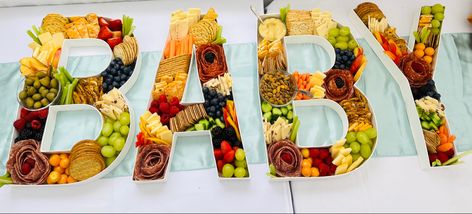 A fun charcuterie board for a baby shower. Boy Charcuterie Board, Baby Letter Charcuterie Board, Baby Charcuterie Board Letters, Charcuterie Letter Board, Baby Charcuterie Board, Charcuterie Board Letters, Baby Shower Charcuterie Board Ideas, Letter Charcuterie Board, Letter Charcuterie