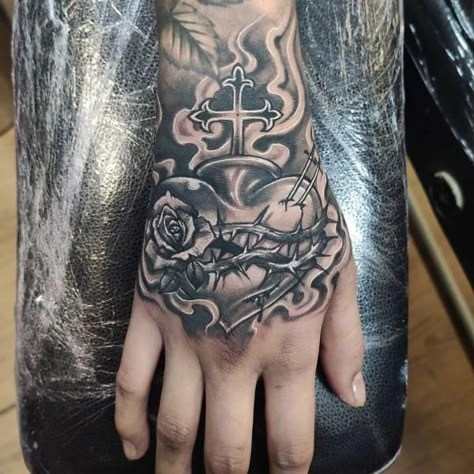 Heart of thorns hand tattoo Sacred Heart Tattoo, Rib Tattoos For Guys, Thorn Tattoo, Full Hand Tattoo, Sacred Heart Tattoos, Rose Tattoos For Men, Tato Henna, Hand And Finger Tattoos, Pretty Hand Tattoos