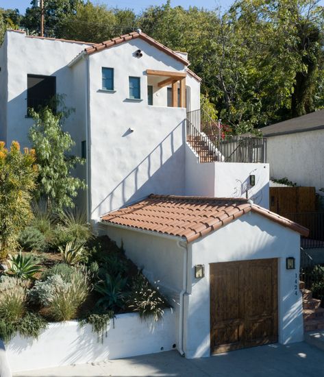 Mediterranean Roof Eaves, Greek Homes Exterior, Mediterranean House Exterior Lighting, Blue Mediterranean House Exterior, Spanish Elevation Design, Mediterranean Elevation, Mediterranean Exterior Design, Silverlake Los Angeles Houses, Greek Homes