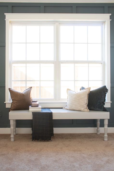 I talked about the awkward shape of our bedroom in my post a few weeks ago. To solve the problem, I knew that I wanted a bench under the window. While I would have loved to build a gorgeous window bench with built-ins on both sides, #windowbench #DIYbench #graybench #farmhousebench #entrywaybench #benchwithpillows #benchunderwindow #benchtutorial #farmhousebedroom #windowbenchbedroom Bench In Front Of Window, Window Bench Seat, Window Seat Design, Window Bench, Window Benches, Bench Decor, Living Room Bench, Bedroom Bench, Diy Window