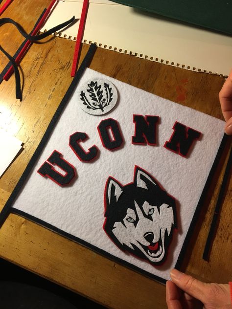 This is for my daughter's high school graduation cap. I cut the letters and the husky out of felt using an exacto knife. Ut Graduation Cap, Uconn Grad Cap, Felt Graduation Cap, Umich Grad Cap, Virginia Tech Graduation Cap, Uw Grad Cap, High School Graduation Cap, Graduation Cap Toppers, Graduation Cap Designs