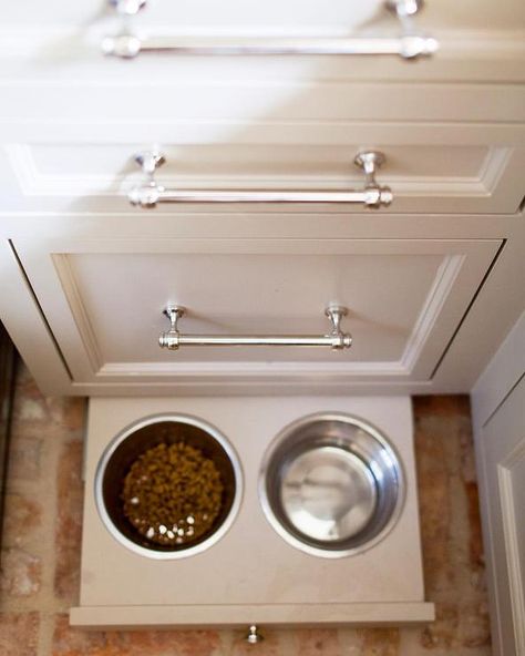 Create a built-in dog accessory storage area that’s integrated into your design along with a slide out food and water station which can be slid out of the way when not in use. Toe Kick Drawer, Transitional Laundry Room, Pet Station, Pet Feeding Station, Diy Dog Food, Pet Food Storage, Food Dog, Dog Food Bowls, Dog Food Storage