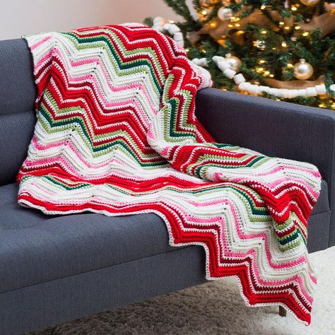 Free Christmas crochet afghan patterns are simply lovely. Make this beautiful throw and keep it on your couch all season! It's perfect for unwrapping presents. Crochet Ripple Pattern, Christmas Afghan, Christmas Crochet Blanket, Afghans Crochet, Crochet Afghan Patterns Free, Crocheted Blanket, Crochet For Beginners Blanket, Easy Crochet Patterns Free, Manta Crochet