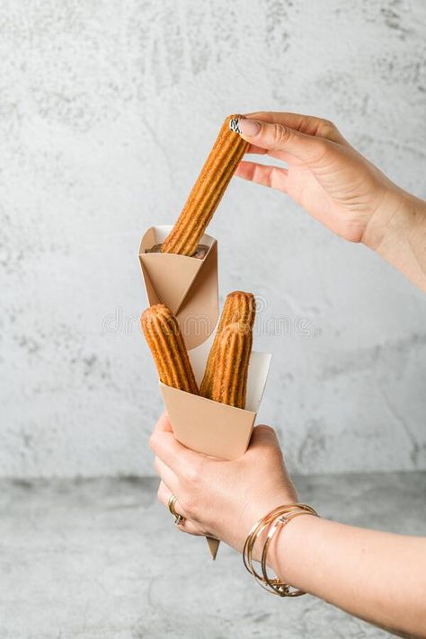 Woman taking churros from a cone and dipping it in chocolate sauce stock images Vector Technology, Chocolate Sauce, Chocolate Dipped, Sauce, Stock Images, Nutrition, Technology, Quick Saves