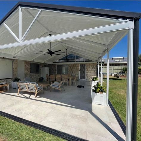 Check out this amazing before and after shot of a DIY Stratco Outback® Clearspan Gable Roof Patio. One of our Queensland patio experts helped design a 3D version for the customer and supported them throughout their DIY Patio project. Get a free quote on your next Stratco home improvement project here bit.ly/stratco-quote Pin to your patio inspiration board 📌 #stratco #australia #howto #patio #outbackdealer #outdoorliving #patiogoals #patioideas #landscaping #patiostyle #outbackgable Stratco Patio, Gable Pergola, Gable Roof Patio, Pergola Extension, Gable Patio, Extension Roof, Patio Roof Extension Ideas, Roof Patio, Backyard Retaining Walls