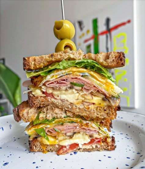 The Best Mortadella Sandwich cut in half and stacked on top of each other with a toothpick and 2 stuffed olives on top Mortadella Sandwich, Pickled Cucumber Salad, Brunch Burger, Sandwich Sauces, Easy Egg Recipes, Meatball Sandwich, Italian Sandwich, Fried Mushrooms, Sandwich Ingredients