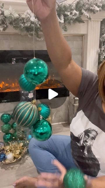 Ivey | Lifestyle + Home on Instagram: "Hey love bugs! Here’s a quick video showing how I made my ornament clusters for my Christmas trees. I’m doing the same technique on the garland on our fireplace. I’ll be sure to link the Christmas wire that I use in my stories.

#ornaments #ornamentclusters #christmastree #christmasdecor #christmastreedecorating #treedecorating #holidaydecor #holidaydecorations #fireplacedecor #fireplacemantel #manteldecor #christmasfireplace #homedecor #homedesign #interiorinspo #christmastips #christmasdiy #diychristmasdecor #decortips #christmasinspo" Christmas Decor Fireplace Ideas, Extra Large Ornaments On Tree, Christmas Tree Near Fireplace, Christmas Ornament Hanging Ideas, Interior Christmas Decor Ideas Cozy, How To Do Ornament Clusters, Window Decoration Ideas For Christmas, Stringing Christmas Ornaments Together, Ornaments Garland Diy