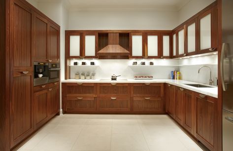 The cabinets are found above and below the countertops across modern kitchens in Pakistan. They are usually separate structures and offer sufficient space to store all kinds of kitchen utensils, equipment and the uncooked food items. Walnut Kitchen Cabinets, Cabinet Door Designs, Modern Wood Kitchen, Wooden Kitchen Cabinets, Contemporary Kitchen Cabinets, Fancy Kitchens, Walnut Kitchen, Kabinet Dapur, Cabinet Door Styles