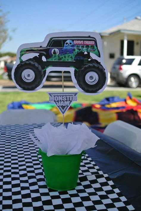 Hand made grave digger centerpiece Grave Digger Centerpiece, Grave Digger Pinata, Monster Jam Centerpieces, Grave Digger Birthday Cake, Grave Digger Birthday Party, Monster Truck Theme Birthday Party, Party Centerpiece Ideas, Monster Jam Birthday Party, Digger Birthday