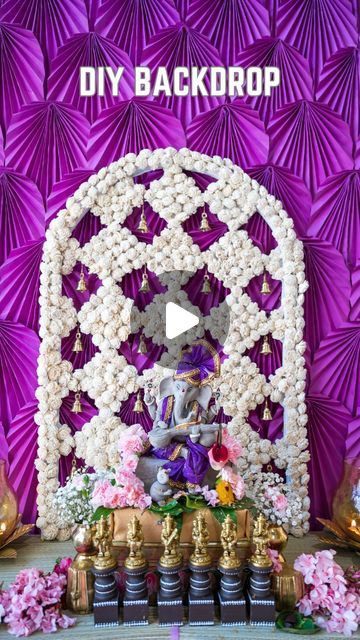 Vishnu Priya on Instagram: "DIY Backdrop using cardboard
Recently I created a backdrop for my festive home decoration and created this large cardboard cutout and added flowers to make my purple and white backdrop the backdrop I made turned out amazing 🤩 If you want a list of all the items I used to make this backdrop comment ‘purple backdrop’. In today’s reel, I’m sharing how I made this flower backdrop. I bought tri-fold cardboard from @michaelsstores 

I hope you enjoyed watching this DIY and got some Ideas for your next home projects.

Comment and let me know how you liked it 
Please share it with your friends and family, FOLLOW for more 

[ How to make cardboard backdrops, DIY backdrop, Indian Festival Backdrops, Diwali Backdrop Decoration, Diwali Decorations at home, Simple decoratio Simple Decoration Ideas At Home, Purple And White Backdrop, Golu Decoration Ideas, Diwali Backdrop Ideas, Diy Diwali Decorations At Home, Diwali Backdrop, Vishnu Priya, Purple Backdrop, Flowers To Make