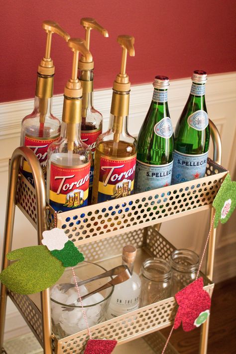 Home Soda Bar, Torani Syrup Storage Ideas, Italian Drinks Nonalcoholic, Italian Soda Bar Wedding, Soda Bar Drink Stations, Bar Cart Christmas Decor, Soda Bar Wedding, Christmas Party Drinks Nonalcoholic, Torani Syrup Recipes Drinks